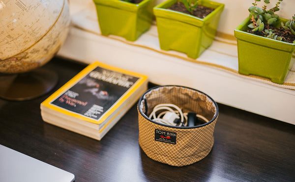 A Small Travel Tray holding some charging cables.